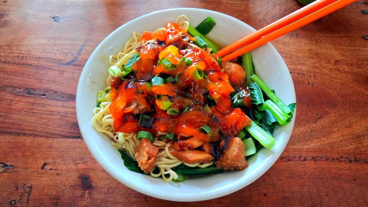 Authentic Indonesian Chicken Noodle Bowl (Mie Ayam) with Chili Sauce, Greens, and Chopsticks – High-Resolution Stock Photo Digital Download